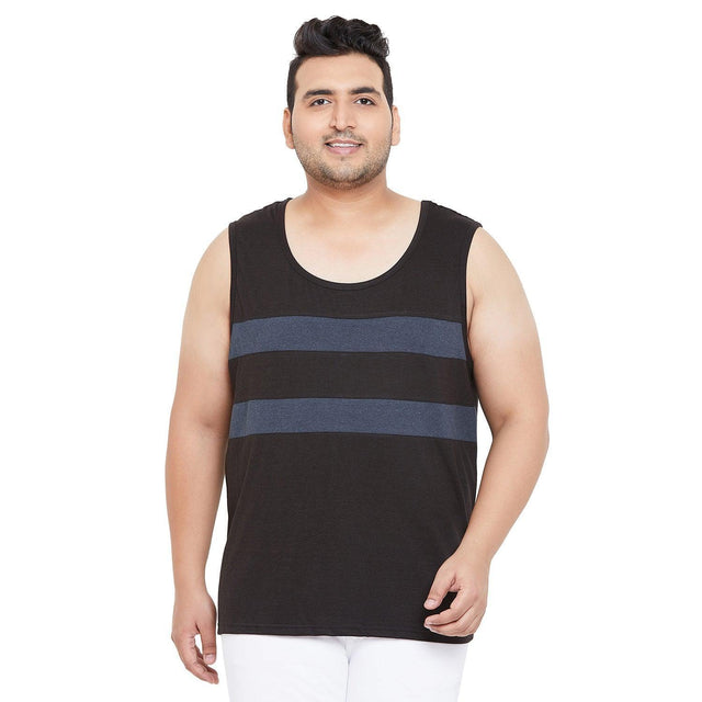 Plus size man wearing black sleeveless tank top with blue stripes and white pants