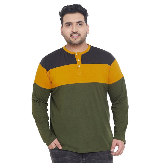 Plus size man wearing colorblock long sleeve henley t-shirt in black, mustard, and olive green