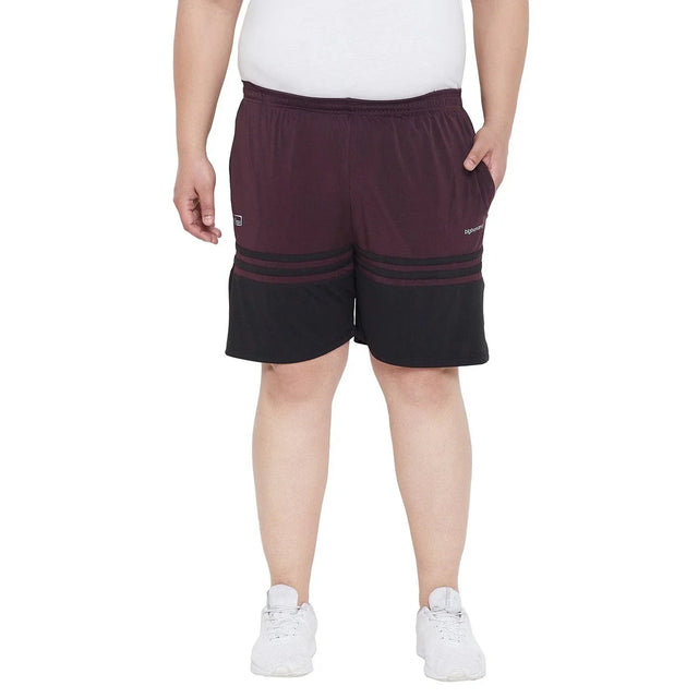Men’s plus size maroon and black shorts, elastic waistband, paired with white sneakers