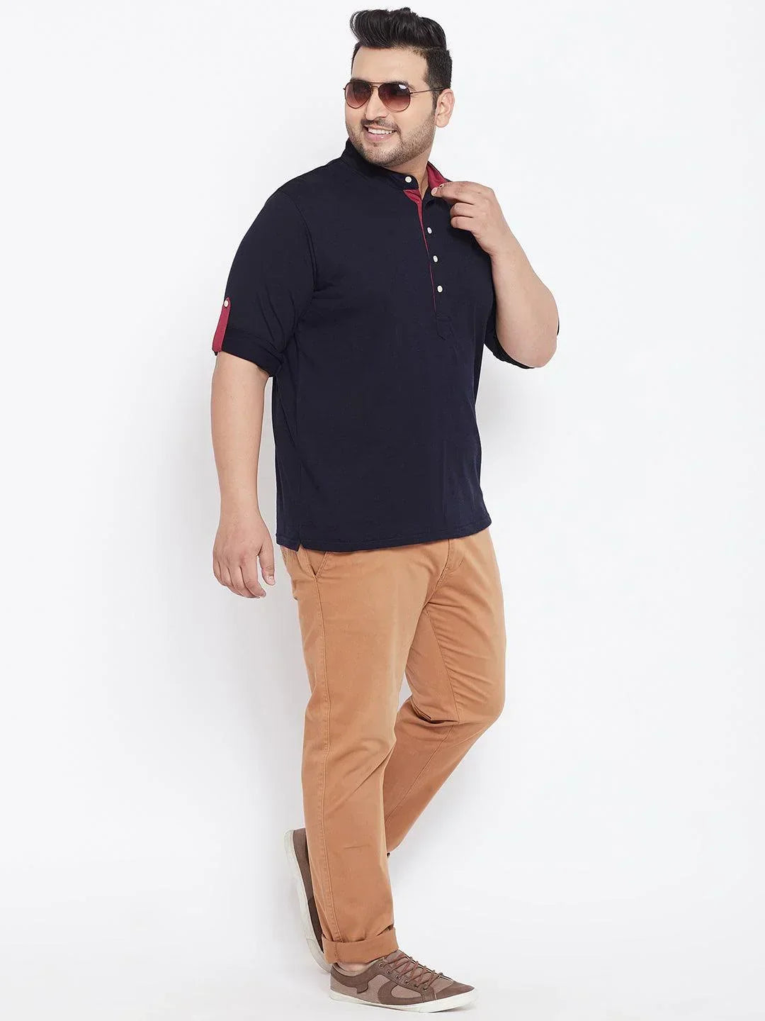 Plus size man in navy mandarin collar shirt and tan chinos, casual fashion for men