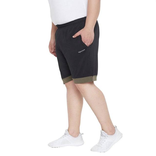Men's plus size black cotton shorts with olive green trim, elastic waist, side pockets