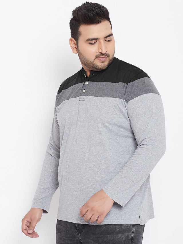 Plus size man wearing grey and black colorblock long sleeve t-shirt