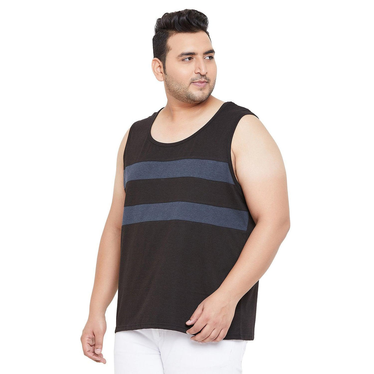 Plus size man in black sleeveless tank top with blue stripes and white pants on white background