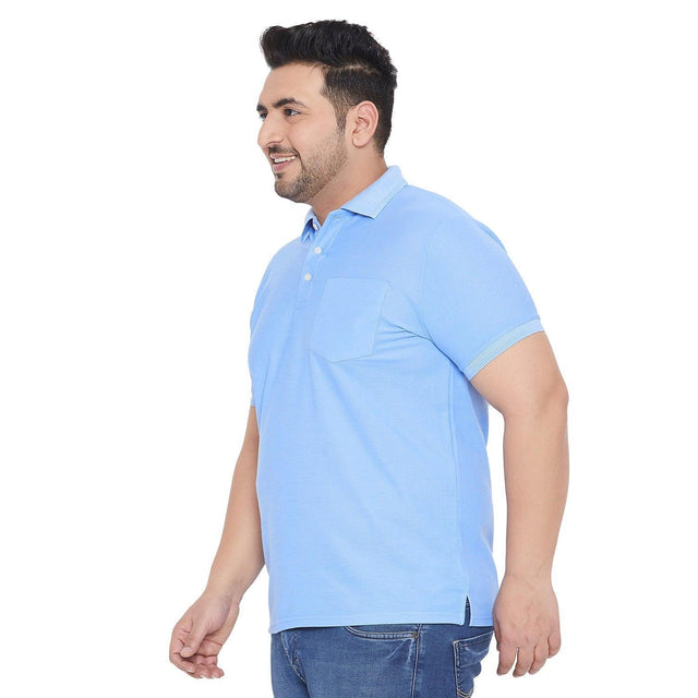 Plus size man in light blue polo shirt and jeans, side view, casual men's fashion