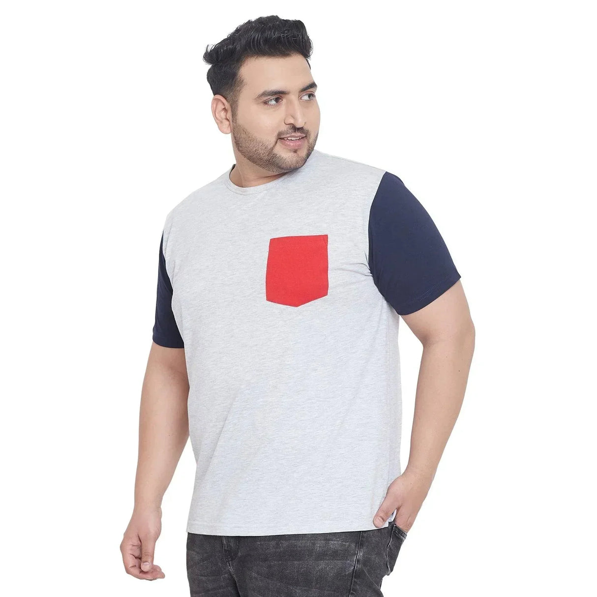 Plus size man in a light grey t-shirt with navy sleeves and red chest pocket
