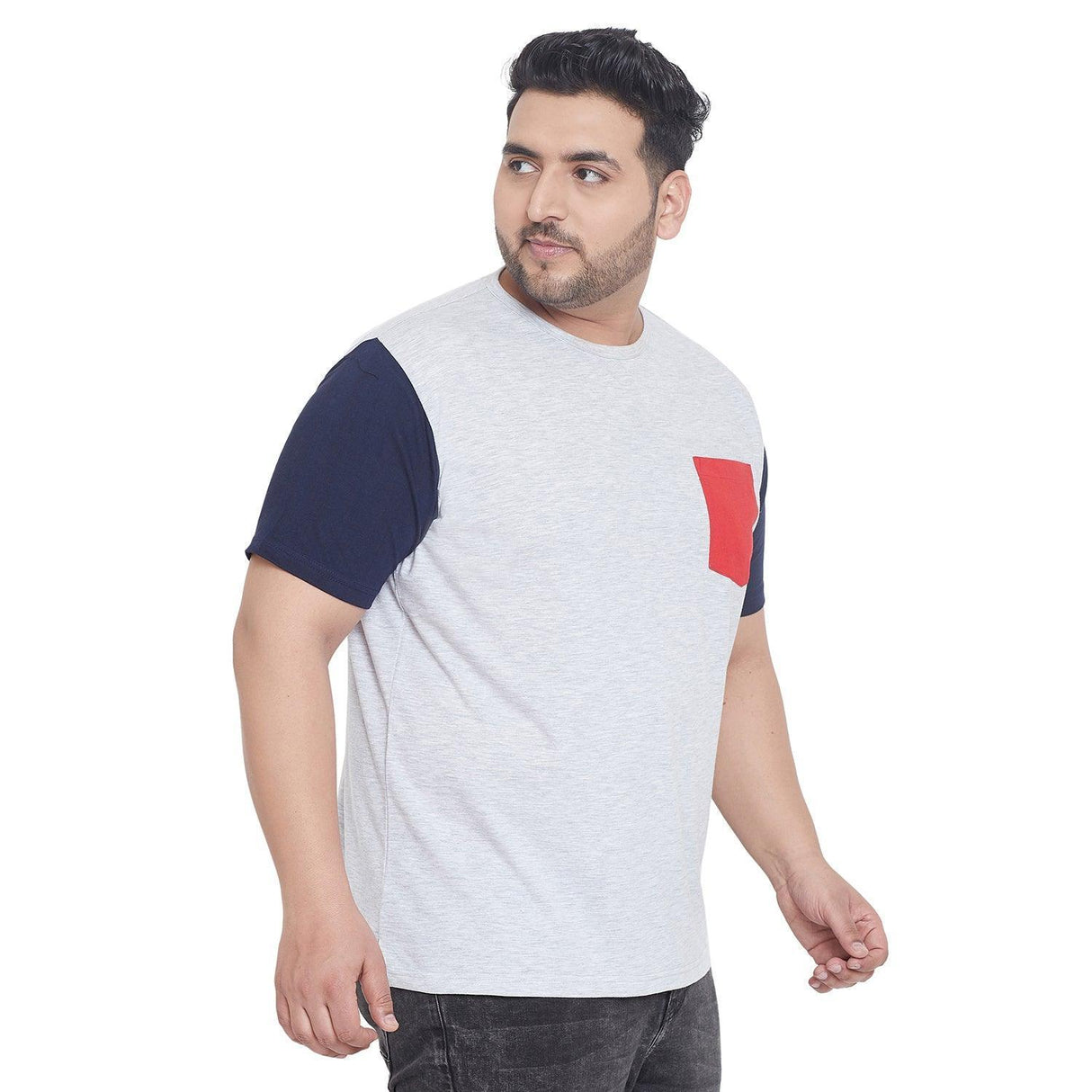 Plus size man wearing grey t-shirt with navy sleeves and red pocket, casual fashion