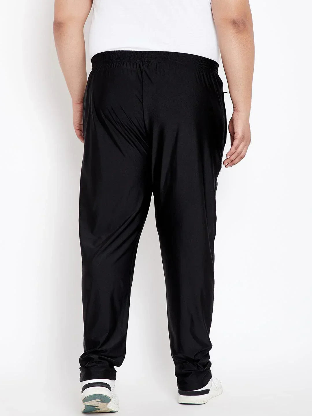 Back view of plus size man wearing black joggers and white T-shirt for men