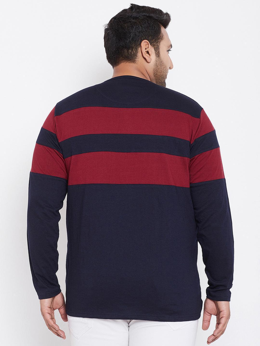 Back view of man in plus size navy and maroon striped long sleeve t-shirt