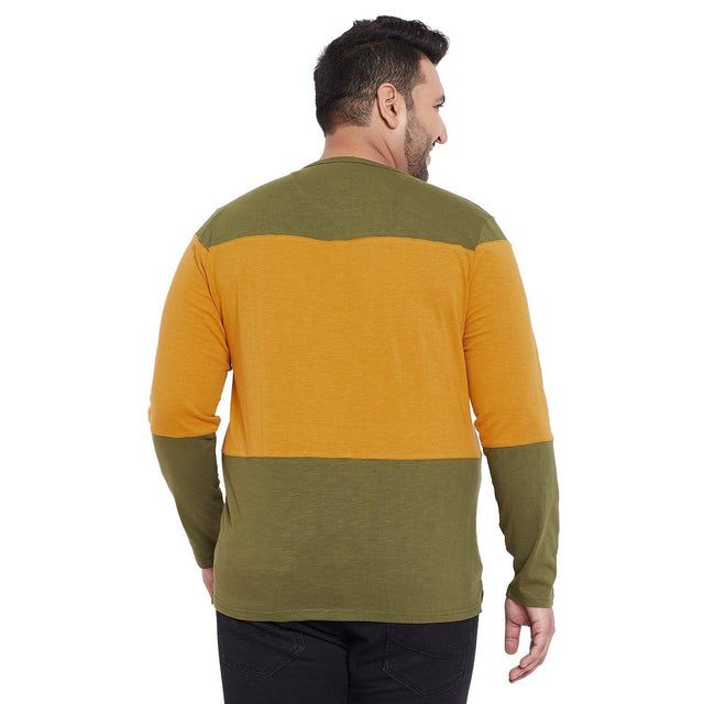 Back view of plus size man wearing mustard and olive colorblock long sleeve t-shirt