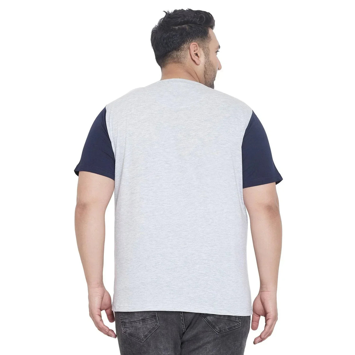 Plus size man wearing a light grey t-shirt with dark sleeves, back view