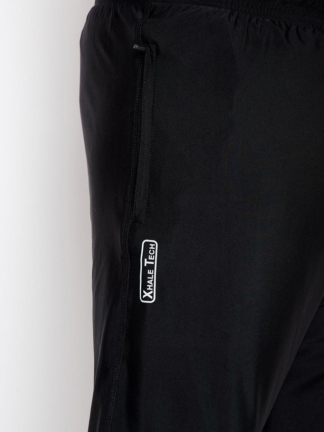 Close-up of black plus size men's joggers with zip pocket and Xhale Tech logo