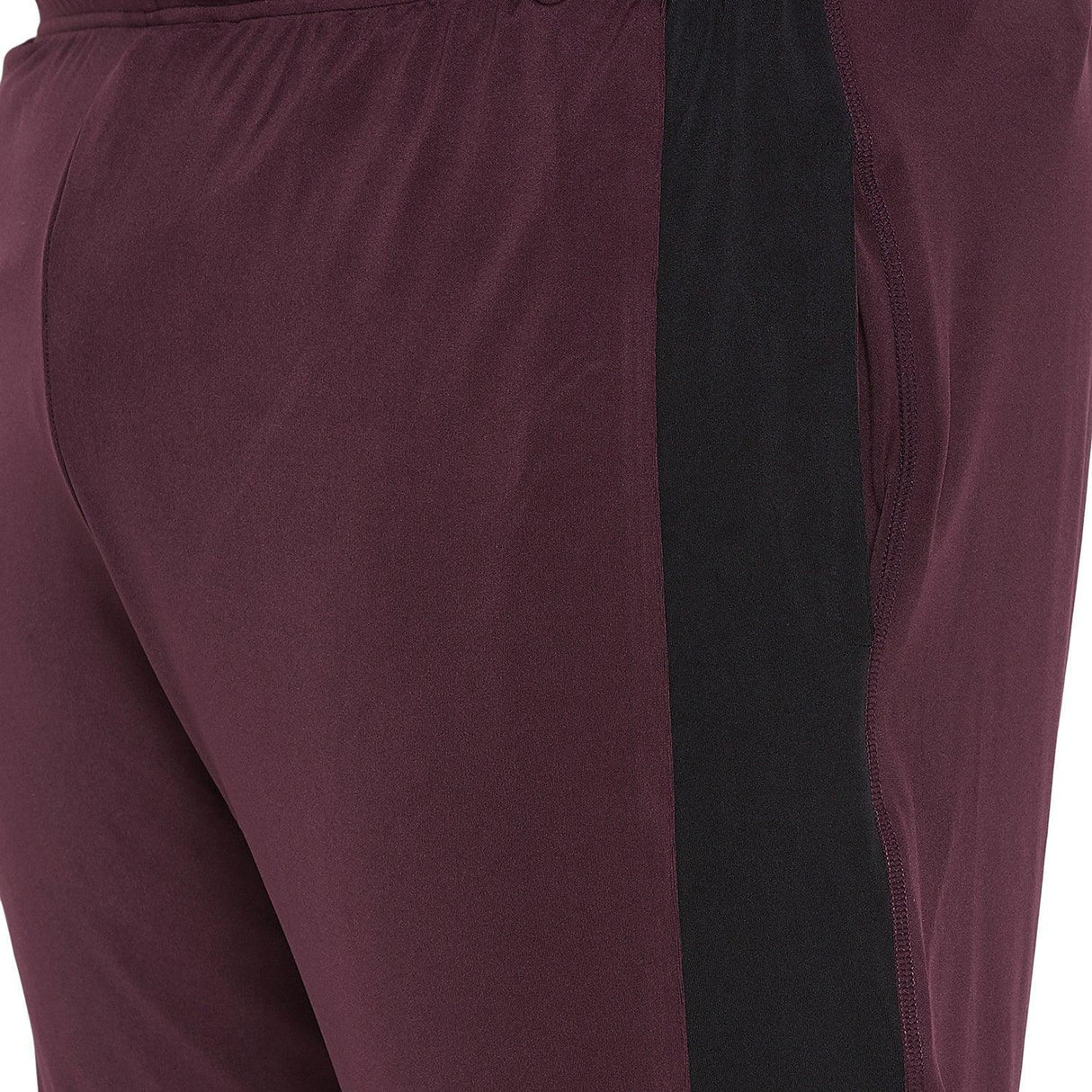 Close-up of maroon plus size men's joggers with black side panel and pocket