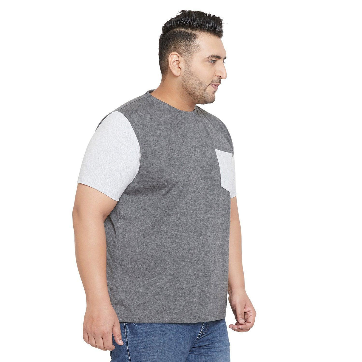 Plus size man wearing grey and light grey short sleeve t-shirt with pocket and blue jeans