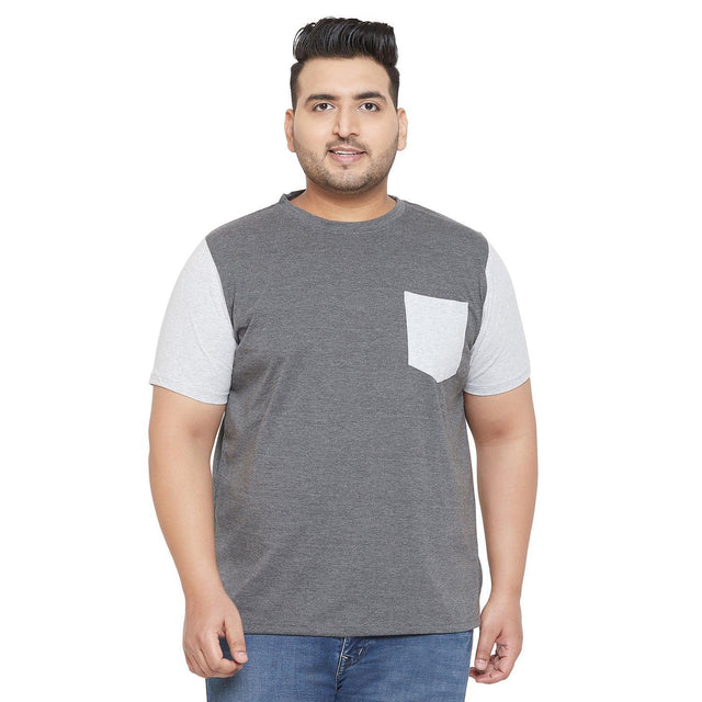 Plus size man wearing a grey and light grey short sleeve t-shirt with chest pocket