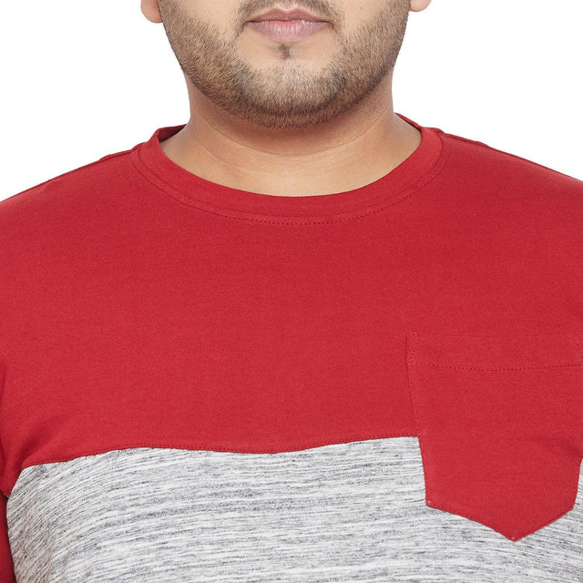 Close-up of a plus size men's colorblock t-shirt with red top panel, grey bottom, and chest pocket