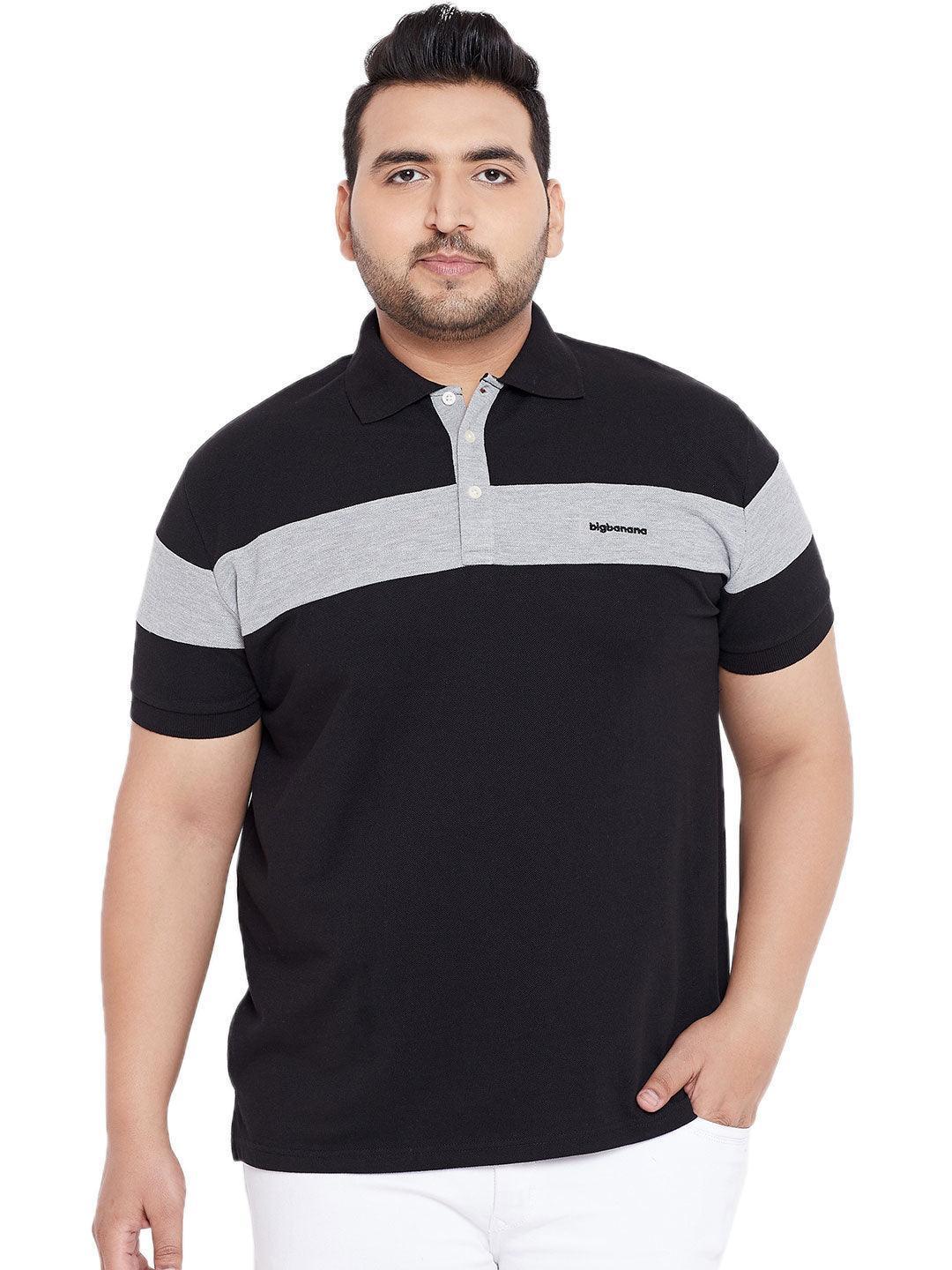 Plus size man wearing black polo t-shirt with grey stripe and white pants, front view
