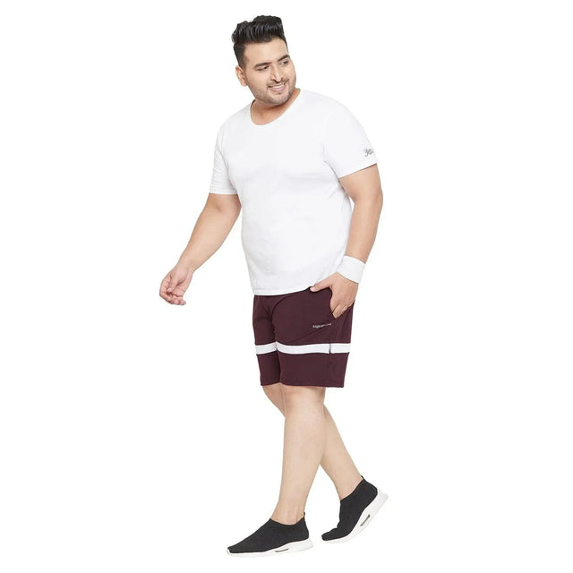Plus size man in white t-shirt and maroon shorts with white stripes, sporty casual look