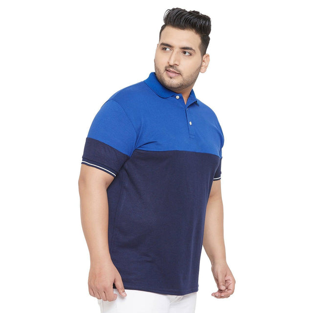 Plus size man wearing blue colorblock polo t-shirt, short sleeves, white background