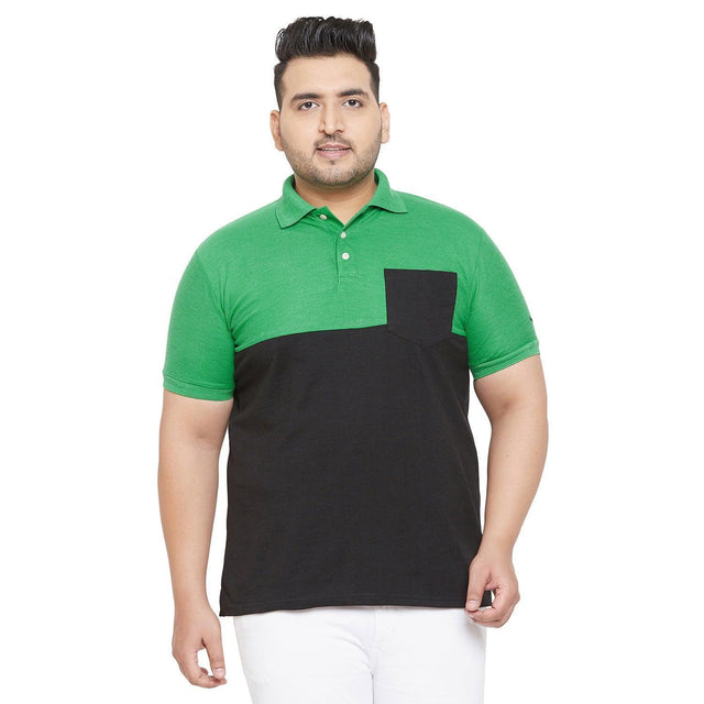 Plus size model in green and black colorblock polo shirt with pocket and white pants