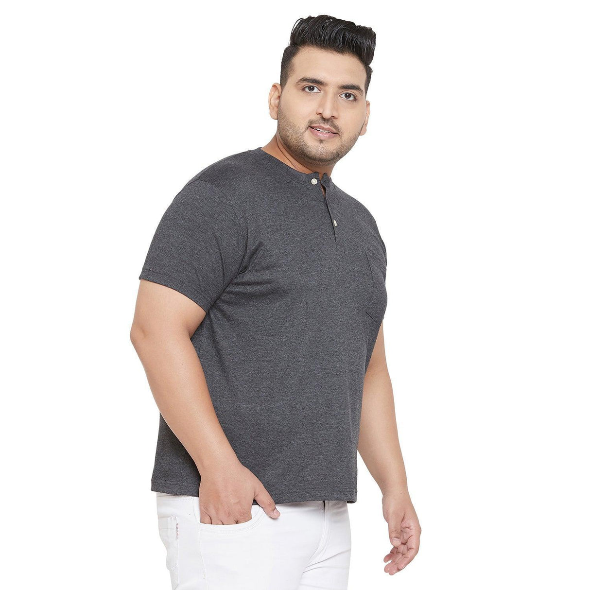 Plus size man wearing a grey short sleeve henley t-shirt and white pants