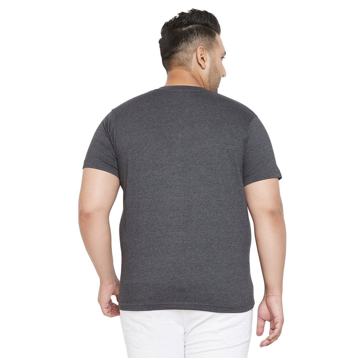 Back view of a man wearing a grey plus size t-shirt and white jeans