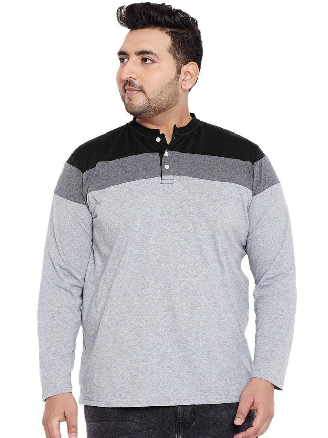 Plus size man wearing a grey long sleeve colorblock henley t-shirt for men