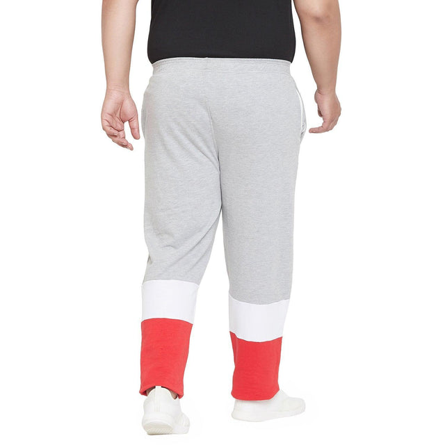 Back view of plus size men's jogger pants, grey with white and red color block legs.