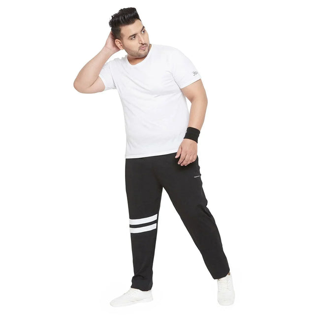 Plus size man wearing white t-shirt and black joggers with white stripes on leg