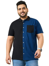 Plus size man wearing a half black, half blue short sleeve shirt with jeans