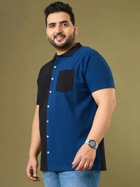 Plus size man in blue and black colorblock short sleeve shirt with black collar and pocket