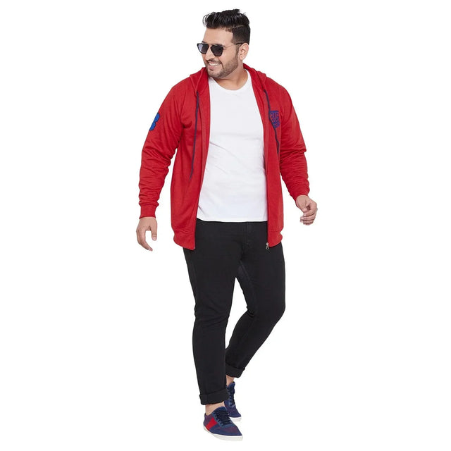 Plus size man in red zip-up hoodie, white t-shirt, black jeans and sneakers