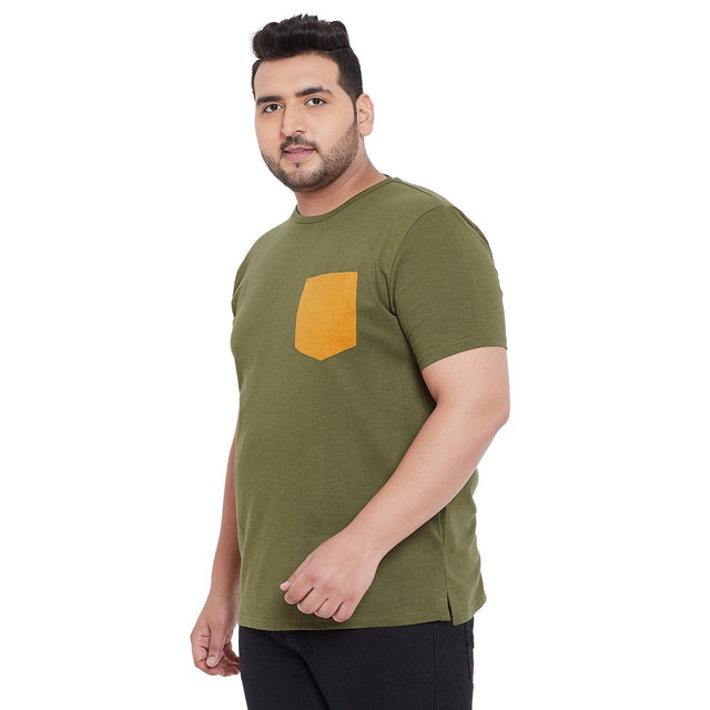 Plus size man wearing olive green t-shirt with yellow chest pocket and black pants