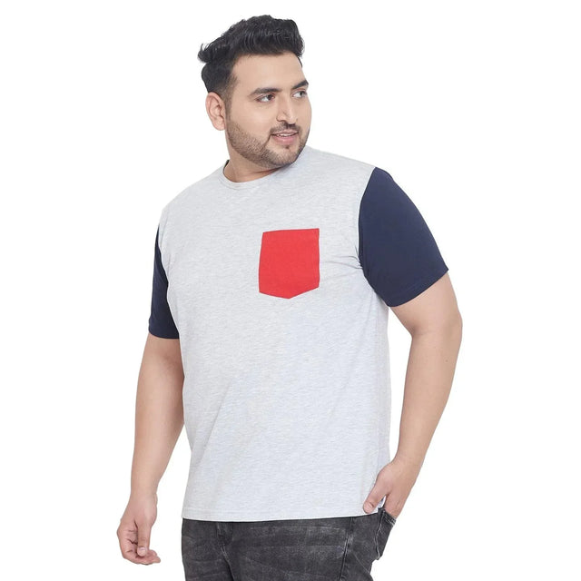 Plus size man in a light grey t-shirt with navy sleeves and red chest pocket