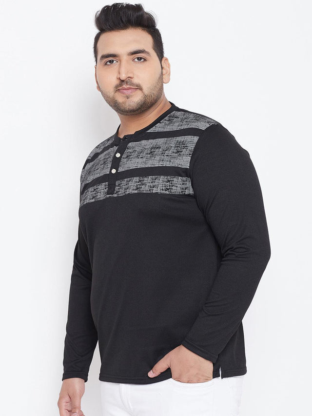 Plus size man wearing a black long sleeve Henley t-shirt with grey patterned stripes