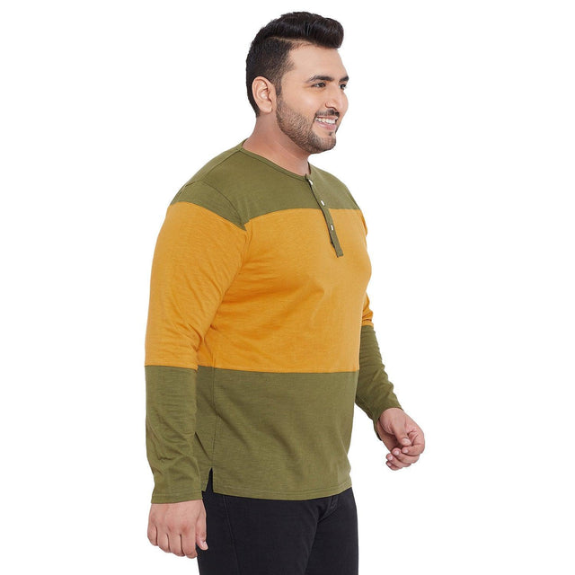 Plus size man in colorblock mustard and olive green long sleeve henley t-shirt