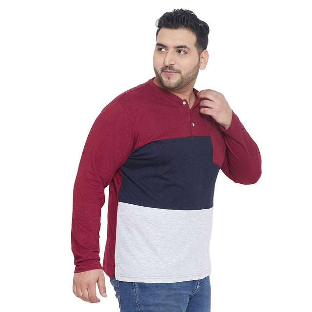 Plus size man in colorblock henley t-shirt with maroon, navy, and grey panels