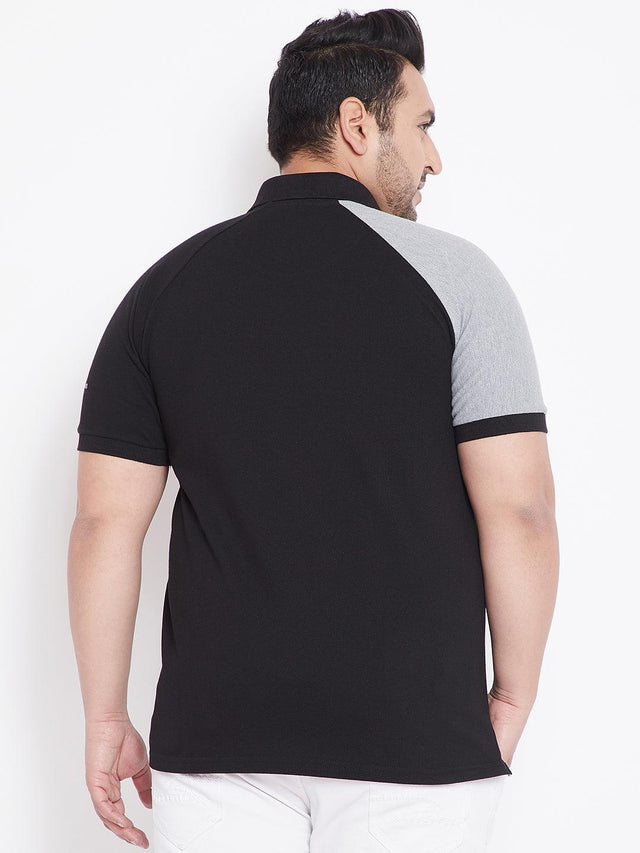 Back view of man in plus size black polo t-shirt with grey raglan sleeves
