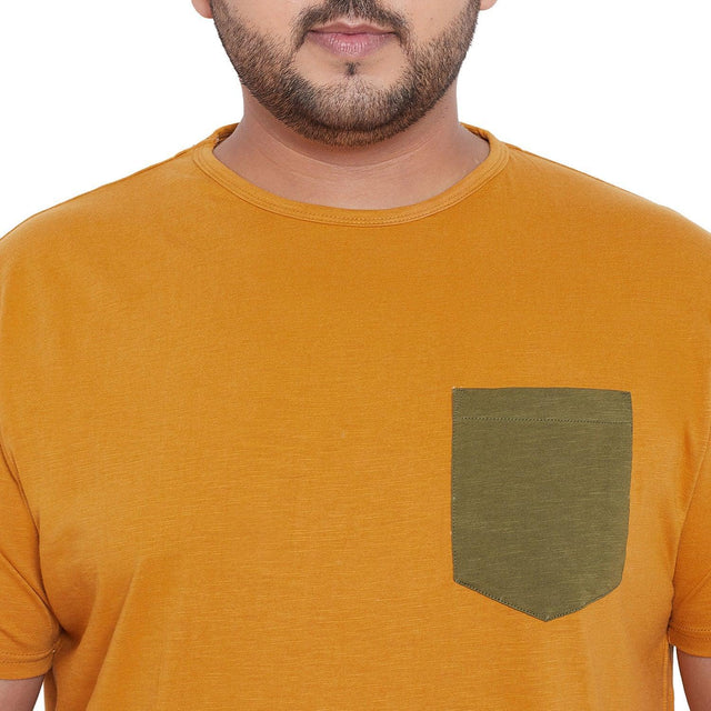 Men's plus size mustard t-shirt with olive chest pocket, casual fit, front view.