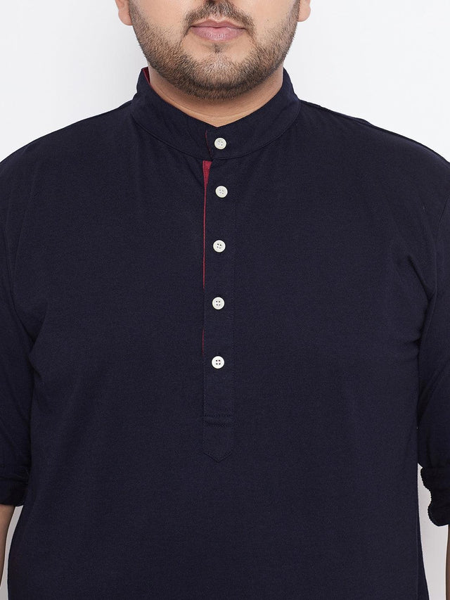 Plus size men's navy blue kurta with mandarin collar and half placket, front buttons visible.