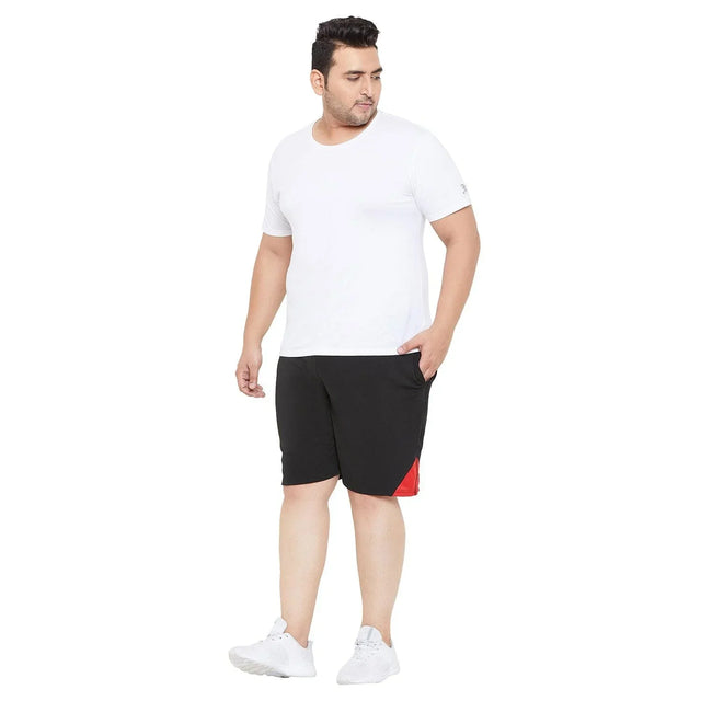Plus size man in white t-shirt and black shorts with red detail, casual fashion look