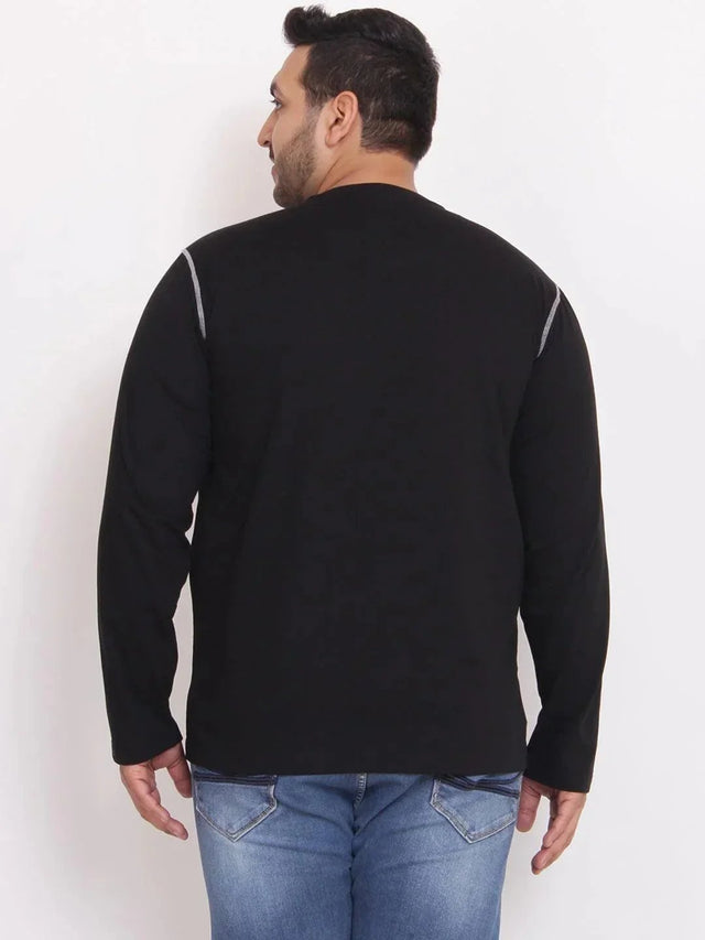 Plus size man in black long sleeve t-shirt and blue jeans, back view against white background
