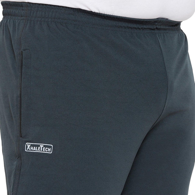 Close-up of plus size men's dark blue joggers with elastic waist, XhaleTech logo, side pocket