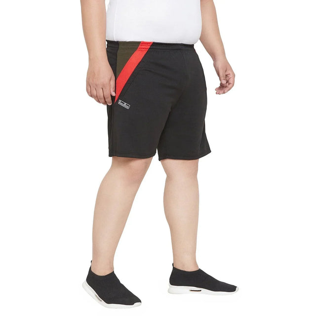Men's plus size black shorts with red and olive stripe, elastic waist, model standing
