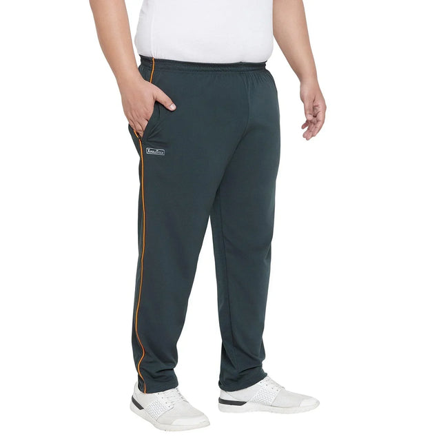 Men's plus size black joggers with orange side piping, elastic waist, and white sneakers