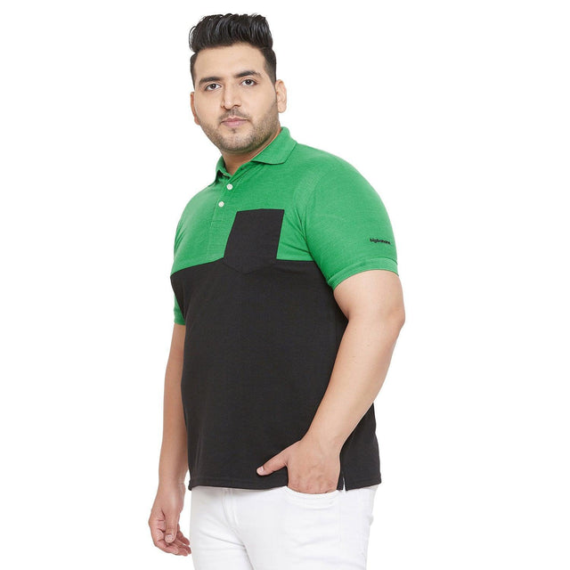 Plus size man wearing green and black colorblock polo t-shirt with pocket against white background