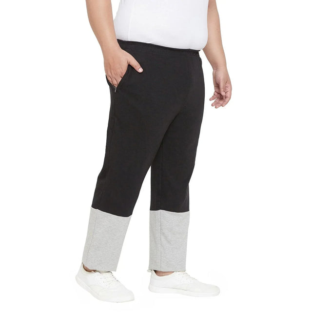 Men's plus size black joggers with grey ankle cuffs, side pockets, and elastic waist