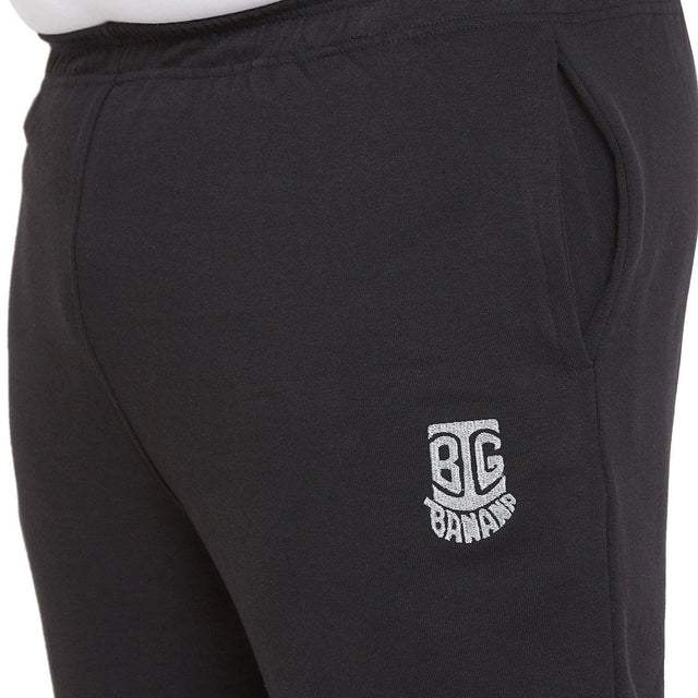Close-up of plus size men's black joggers with side pocket and embroidered logo