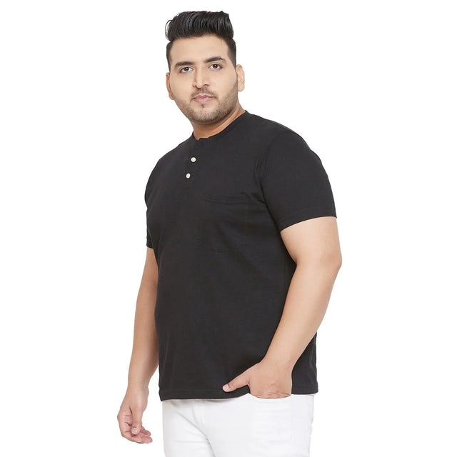 Plus size man wearing black short sleeve henley t-shirt with buttons and front pocket
